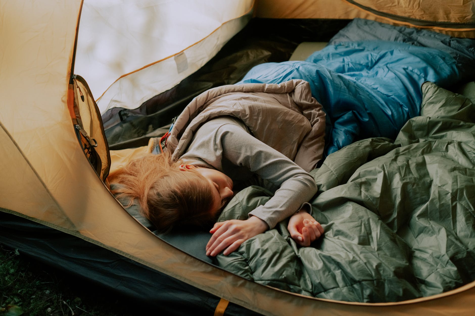 woman sleeping inside a tent